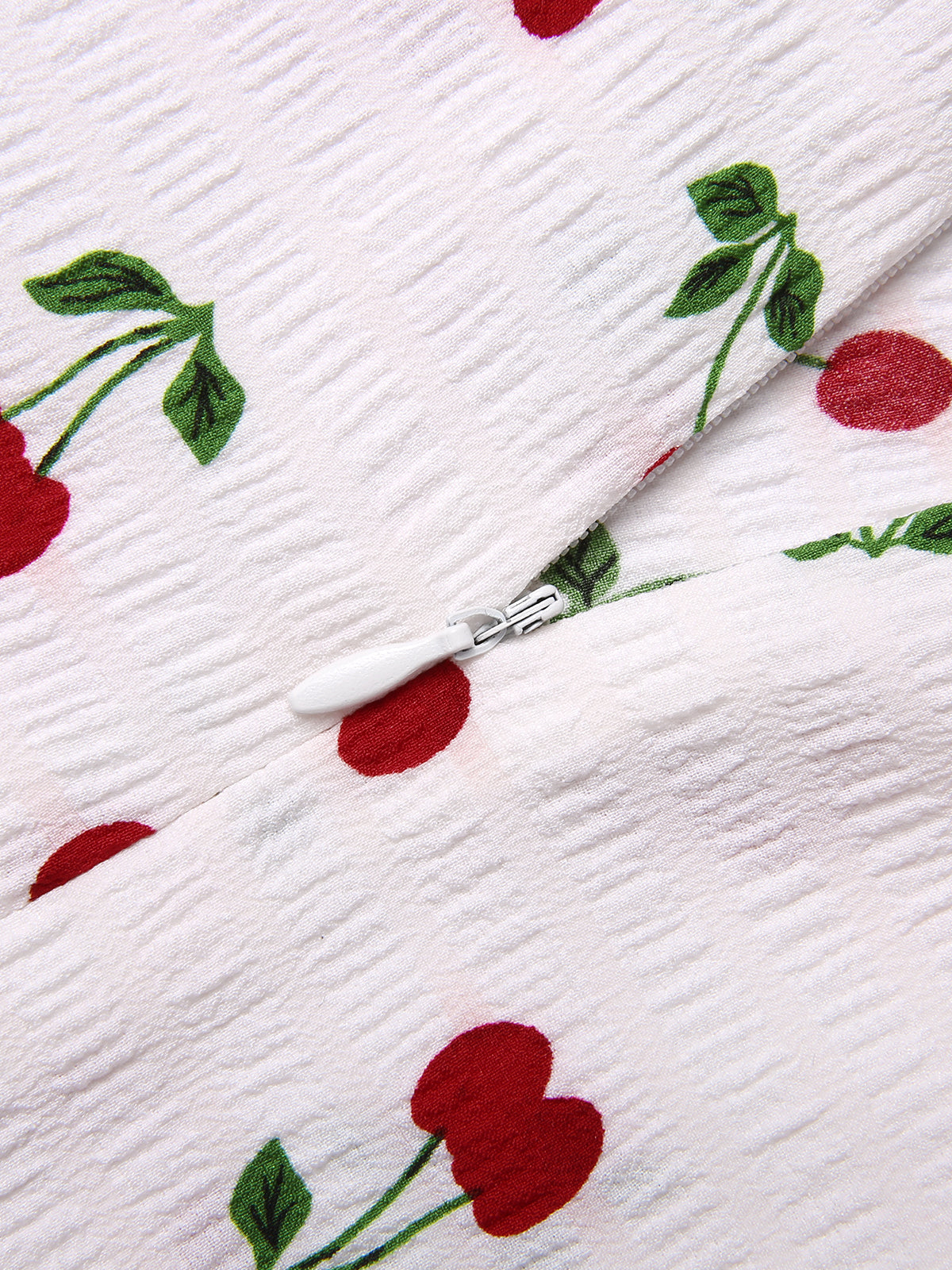 Beżowy kombinezon w groszki z lat 30. XX wieku z dekoltem w serduszko