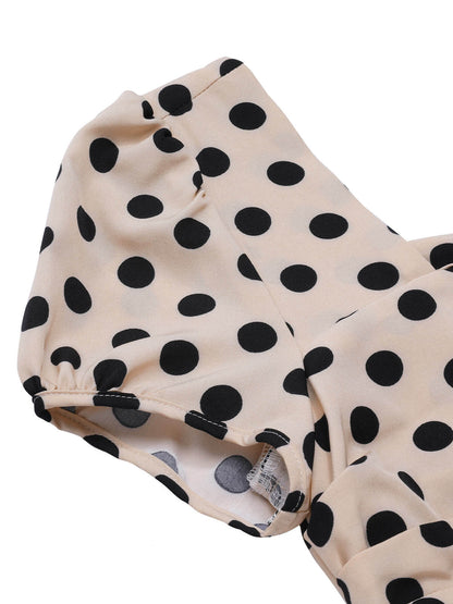 Sukienka koktajlowa pin-up z lat 50. w stylu vintage, w czarne groszki